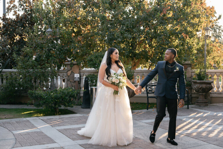 Bride and groom in a European inspired Bakersfield wedding venue in the garden courtyard