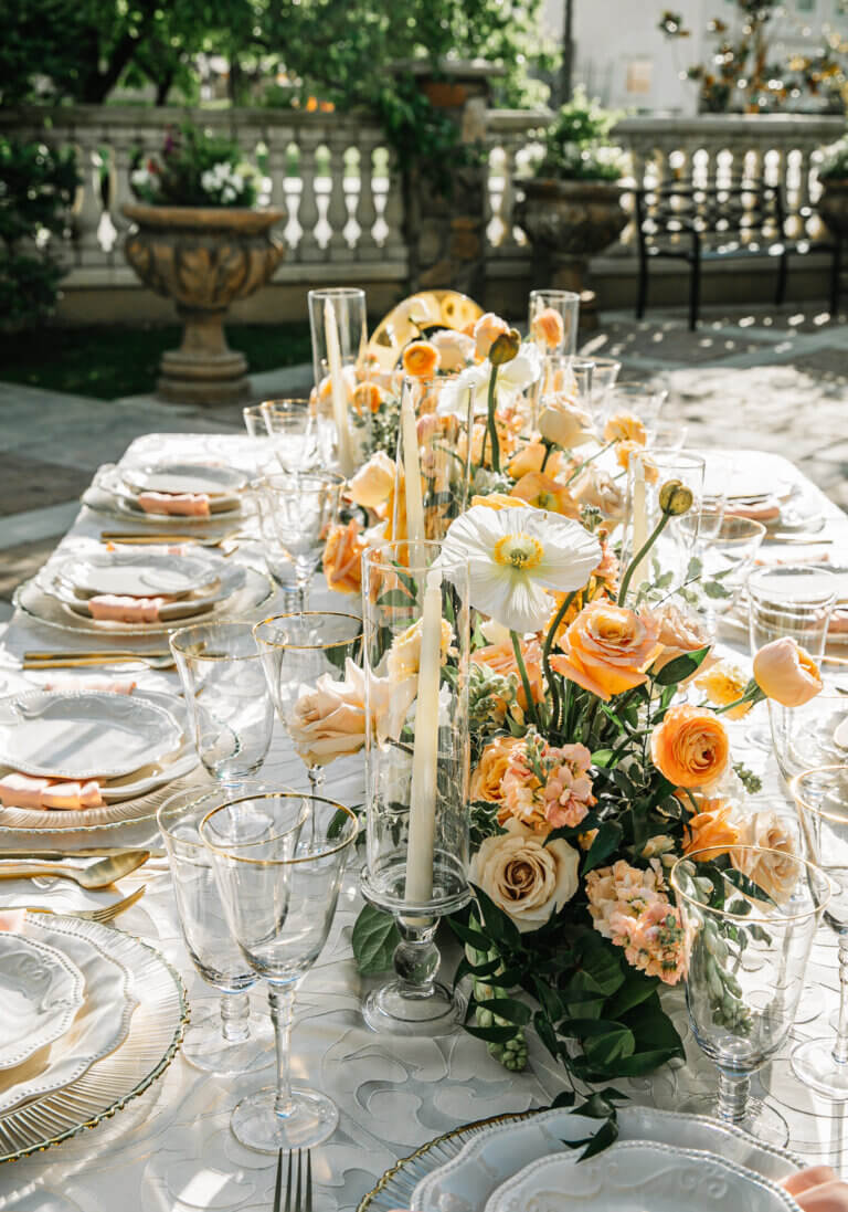 Luxury spring weddings in Bakersfield table setting with poppies and ranunculus along with gold rimmed dinnerware
