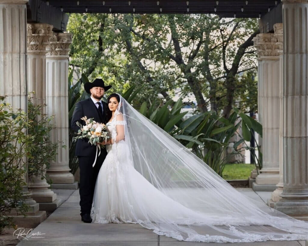 Tuscan Bakersfield wedding venue bride with a cathedral length veil